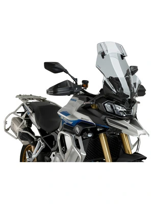 Touring windshield with spoiler