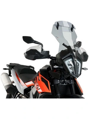 Touring windshield with spoiler